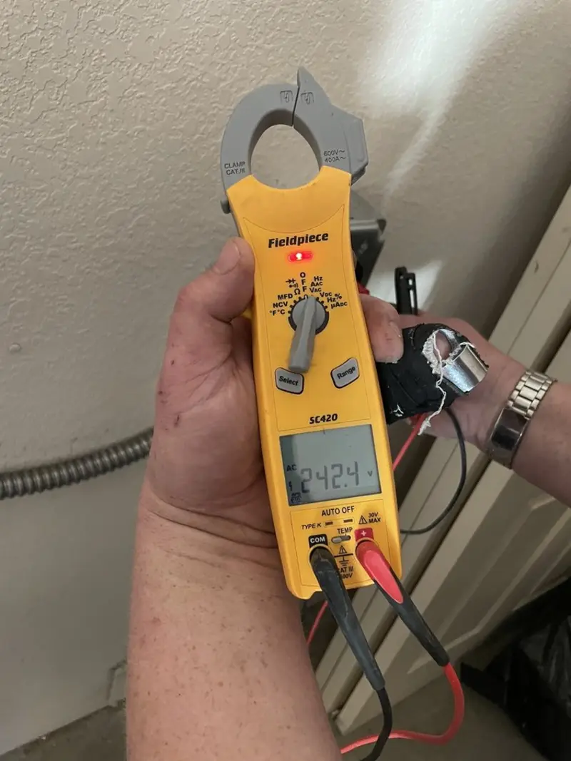 Voltage testing with clamp meter during Circuit Breaker Repair in Clanton